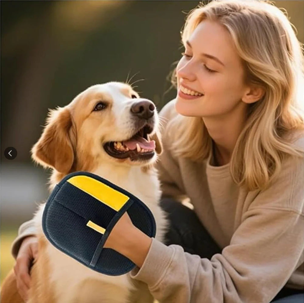 Woman holding a blue and yellow pet product while sitting with a dog outdoors.